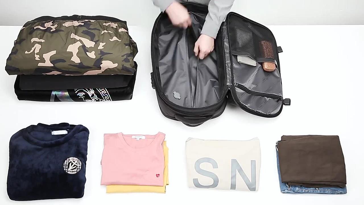 Actual packing demonstration showing the backpack, clothing and travel essentials